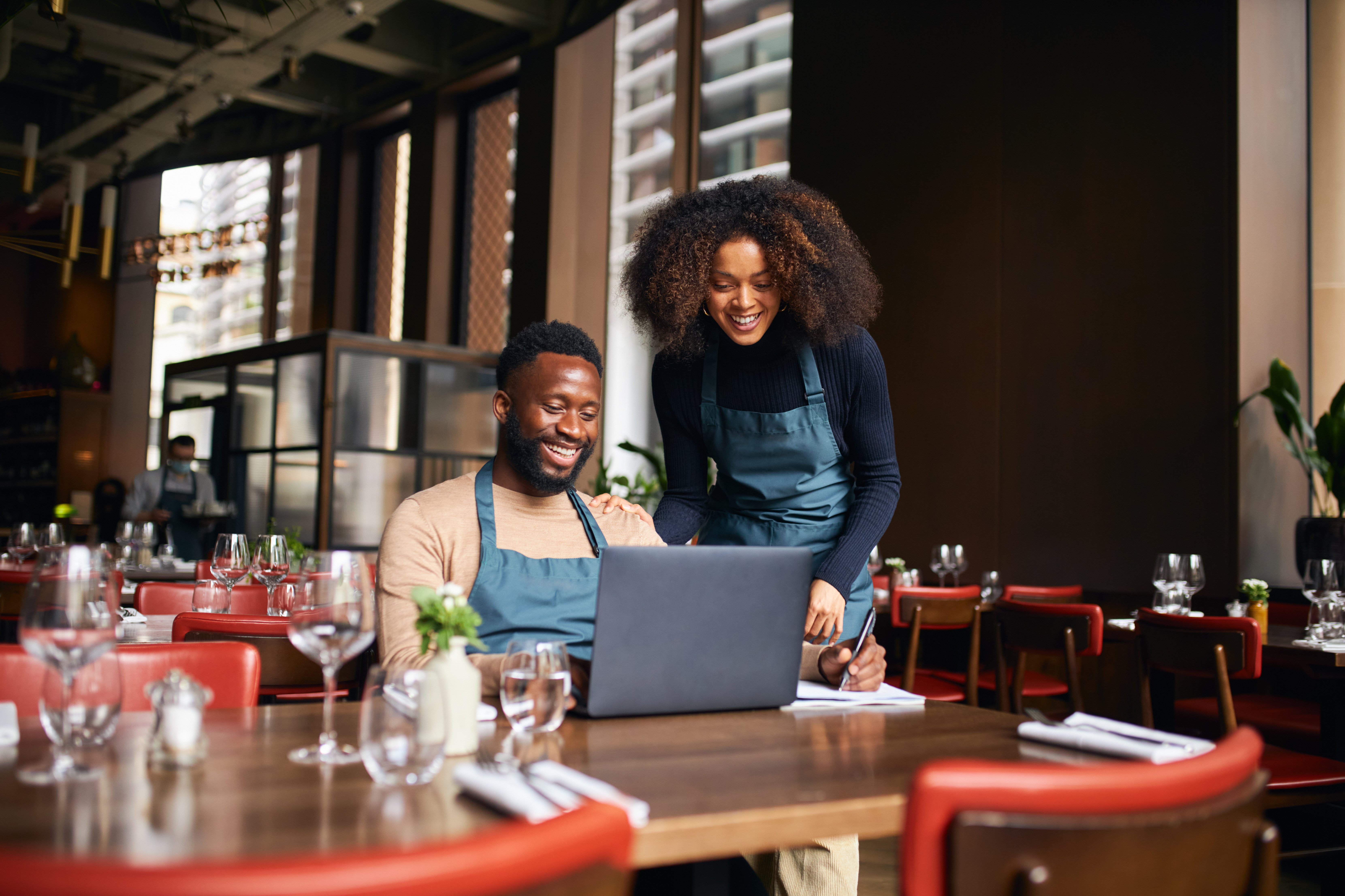 Restaurant colleagues reviewing their operation